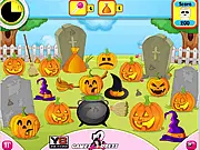 Screenshot of the Halloween Candy Catch game showing a swinging sticky arm about to grab multiple pieces of candy from a pile of spooky Halloween treats