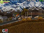 Motocross Dirt Challenge free online racing game screenshot showing a dirt bike mid-air on a hill climb track against a rival biker