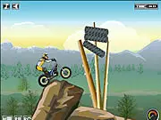 The Real Trial game screen showing a dirt bike rider carefully balancing on a treacherous wooden ramp obstacle course