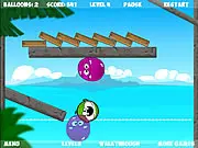 Screenshot of Bubble Friends physics puzzle game showing a small fish stuck on a platform and a player preparing to launch a bubble (balloon) to push a block and clear a path to the water below. Play free online physics puzzle.