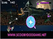 Scooby Doo Halloween Fly online game screenshot of Scooby battling demons in the dark