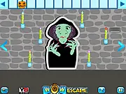 The spooky, dimly lit room in the free online point-and-click game Wow Witch Room Escape