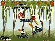 Toucan in the Jungle Puzzle online game screenshot, showing a toucan and apples on a colorful jungle level with various physics objects like ropes and blocks.