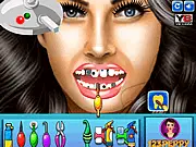 The character Megan Fox sitting in the dentist chair, with close-up view of teeth being cleaned and prepared for a dental makeover