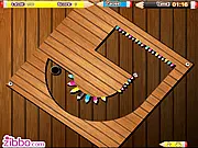 Pencil Panic marble maze game screenshot - guiding a ball through a narrow path lined with sharp pencils.