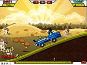 Angry Birds Transport free online game screenshot showing a red Angry Birds-themed truck driving slowly over a bumpy hill with caged pigs in the cargo bed.