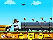 Extreme Stunts free bike driving game online - Rider performing stunts and collecting coins on a dangerous track.