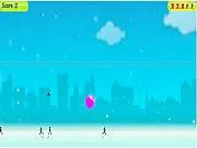 Gameplay screenshot showing vibrant colored water and powder being dropped from above onto cartoon characters walking on the street in the free online game Holi Drops.