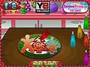 Screenshot of Christmas Cookbook free online game showing beautifully decorated Christmas cookies, including gingerbread men and stars, on a festive table