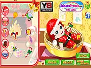 Screenshot of Cute Santa Baby Dress Up showing an adorable baby boy wearing a red and white Santa-themed outfit in this free online Christmas game.