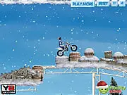 Screenshot of the Winter Bike Stunts game showing a dirt bike rider attempting a high jump over a challenging winter obstacle on PlayArcadeHub