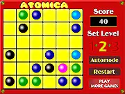 The classic Atomica puzzle game interface showing colored atoms on a hexagonal grid board.