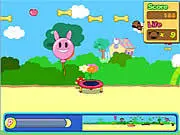 Cannon Dog game screenshot showing a puppy being launched from a large cannon toward a scoring target
