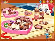 Chocolates Box Decoration game art showing a brightly colored, decorated gift box with ribbons, a creative design game online