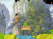 Tarzan swinging on a vine over a dangerous, rocky canyon in the Jungle of Doom online game.