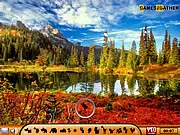 Hidden Animals-Autumn Season online game screenshot, finding a hidden creature in a forest of red and yellow leaves