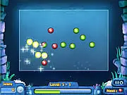 Magic Marble free online game screenshot, player aiming a colored marble at a moving chain of marbles