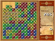 Feyruna Crystals free online game screenshot, showing a grid of colorful gems and a cute glowworm trapped inside a crystal prison