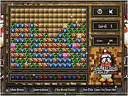 Speed Breakers Deluxe game grid showing a matrix of colorful gems, with a bomb power-up ready to be used to clear a large area.