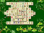 Mahjong Gardens tile-matching puzzle game screenshot showing a layout of matching tiles in a tropical setting