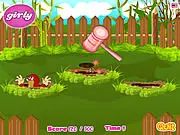Classic Whack-A-Mole free online game screenshot with a hammer, cartoon moles, and dangerous spikes popping out of holes.