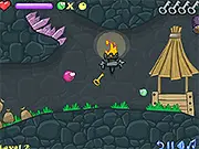 Screenshot of Frizzle Fraz 2 online showing the fuzzy character jumping on a colorful platform while rescuing a small Frizzle, free platformer game