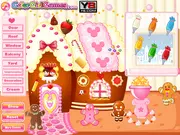 Christmas Gingerbread House game screen, decorated gingerbread house surrounded by candies, cakes, and icing
