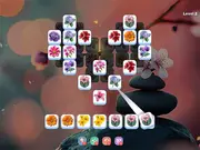 Screenshot of Zen Garden Match free online puzzle game with colorful flower tiles and a tranquil background