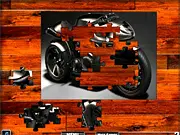 Screenshot of the Black Racing Motorbike Jigsaw game selection screen, showing options for EASY, MEDIUM, and HARD difficulty modes, or a partially completed jigsaw puzzle of a black racing motorcycle.