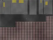 The small robot hero jumping over a laser obstacle in the dark, futuristic, dystopian setting of the 2070 platformer game