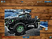 Gameplay screenshot of the Wrangler Jeep Jigsaw game showing scattered puzzle pieces of a red or yellow Jeep Wrangler on an off-road track.