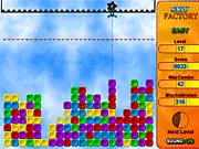 Gameplay screenshot of the Sky Factory online puzzle game, showing a grabber tool moving colored blocks below the red survival line