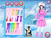 Eskimo Princess Dressup game screenshot showing a princess wearing a fashionable, warm fur-trimmed parka and winter boots in a snowy landscape