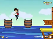 Ryder from Paw Patrol jumping from a wooden barrel in the free online game Paw Patrol Pirate Adventure on PlayArcadeHub