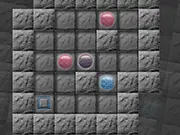 Screenshot of Blue-Orb Puzzle free online game, showing blue spheres that need to be pushed into target squares within a maze-like layout