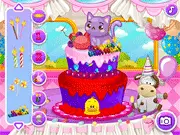 Birthday Pet Cake Maker game screenshot, three layered cake decorated with bones and paw prints, play free online decorating game