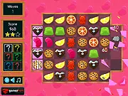 Screenshot of Yummy Nyamy puzzle game board filled with colorful candies ready to be matched
