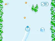 Snow Roll game screenshot, penguin character rolling down a snowy hill and avoiding dangerous trees, play free online arcade game