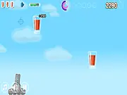 Ice cube being tossed towards a glass, playing IceQBlast free online puzzle game