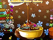 Decorating a rich chocolate dessert with sprinkles, fruit, and toppings in the free online cooking and decorating game Chocolate Maker Factory.