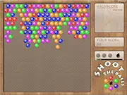 Shoot the Balls free online game screenshot, player aiming a bubble shooter cannon at a dense field of colored balls