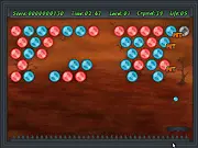 Screenshot of the Death Crystals online game showing a paddle and a multi-colored ball smashing through a wall of crystal blocks