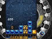 Free online puzzle game Tzolkin showing colored blocks being matched in a physics-based Mayan mechanism.