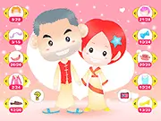We Getting Married free online dress up game screenshot showing a customized bride in a white gown and groom in a tuxedo