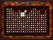 Gameplay screenshot of Ancient Vortex Blast showing a grid of brightly colored blocks ready to be cleared by clicking on groups.