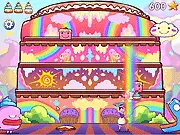Screenshot of the physics puzzle game Alpha Cakes showing several small cake characters positioned on colored blocks, waiting to be guided to a target.