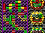 The gameplay screen of Dr Demon, showing a bottle-shaped well filled with colored viruses and a dual-colored pill falling from the top, ready to be placed.