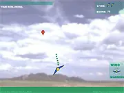 KF 9000 free kite flying arcade game screenshot showing a kite in the air collecting red and yellow balloons against a blue sky
