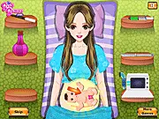 Cute Girl Giving Birth free online game screenshot showing a girl in a hospital bed with a baby