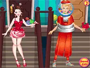 Gameplay screenshot of Sweetooth Valentine Dressup showing a boy and girl couple wearing outfits made from various candies and sweets on a Valentine's Day themed background